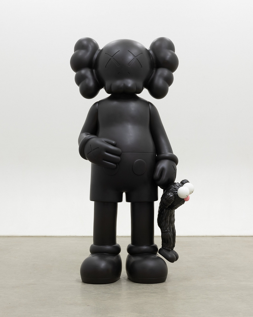 Eine stehende, schwarze Cartoonfigur mit Totenkopfkopf und X-Augen hält eine kleinere, pelzige Figur in der Hand.