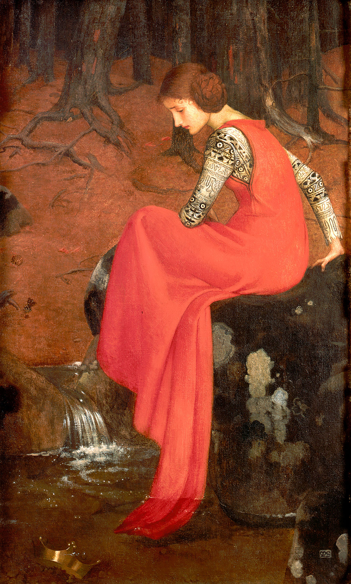 Young woman in a red dress sitting in a forest by a stream.