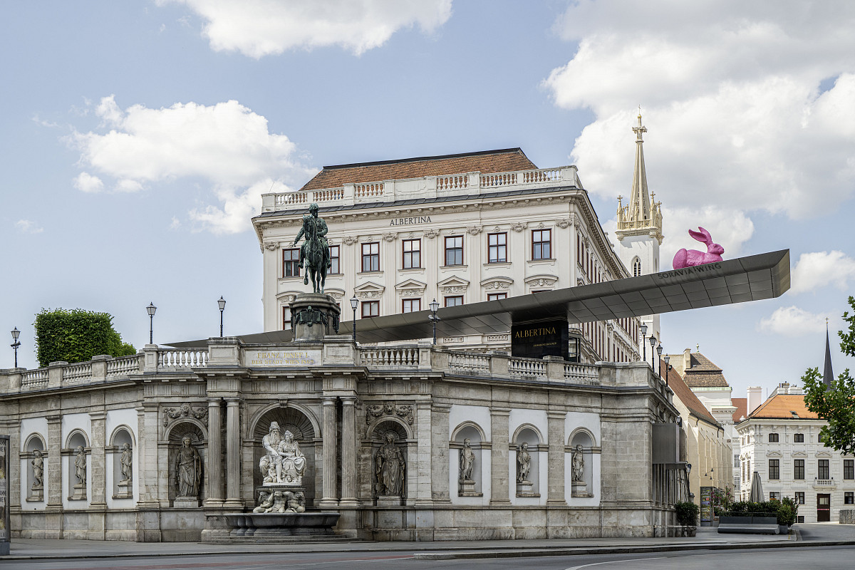 Exterior view of the Albertina with a pink rabbit on the canopy